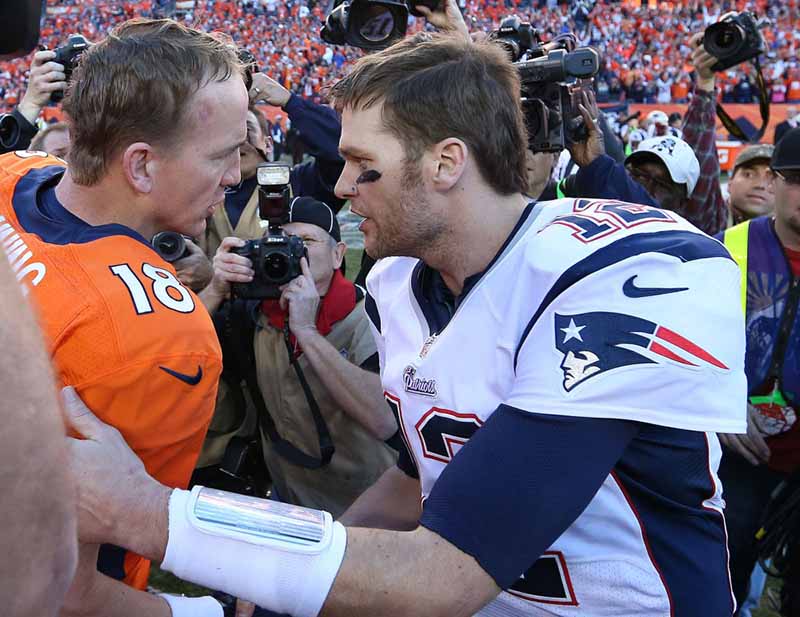 Jan 19, 2014; Denver, CO, USA; Denver Broncos quarterback Peyton Manning (18) meets with New England Patriots quarterback Tom Brady (12) after the 2013 AFC Championship game at Sports Authority Field at Mile High. Mandatory Credit: Matthew Emmons-USA TODAY Sports usp ORG XMIT: USATSI-174802 [Via MerlinFTP Drop]